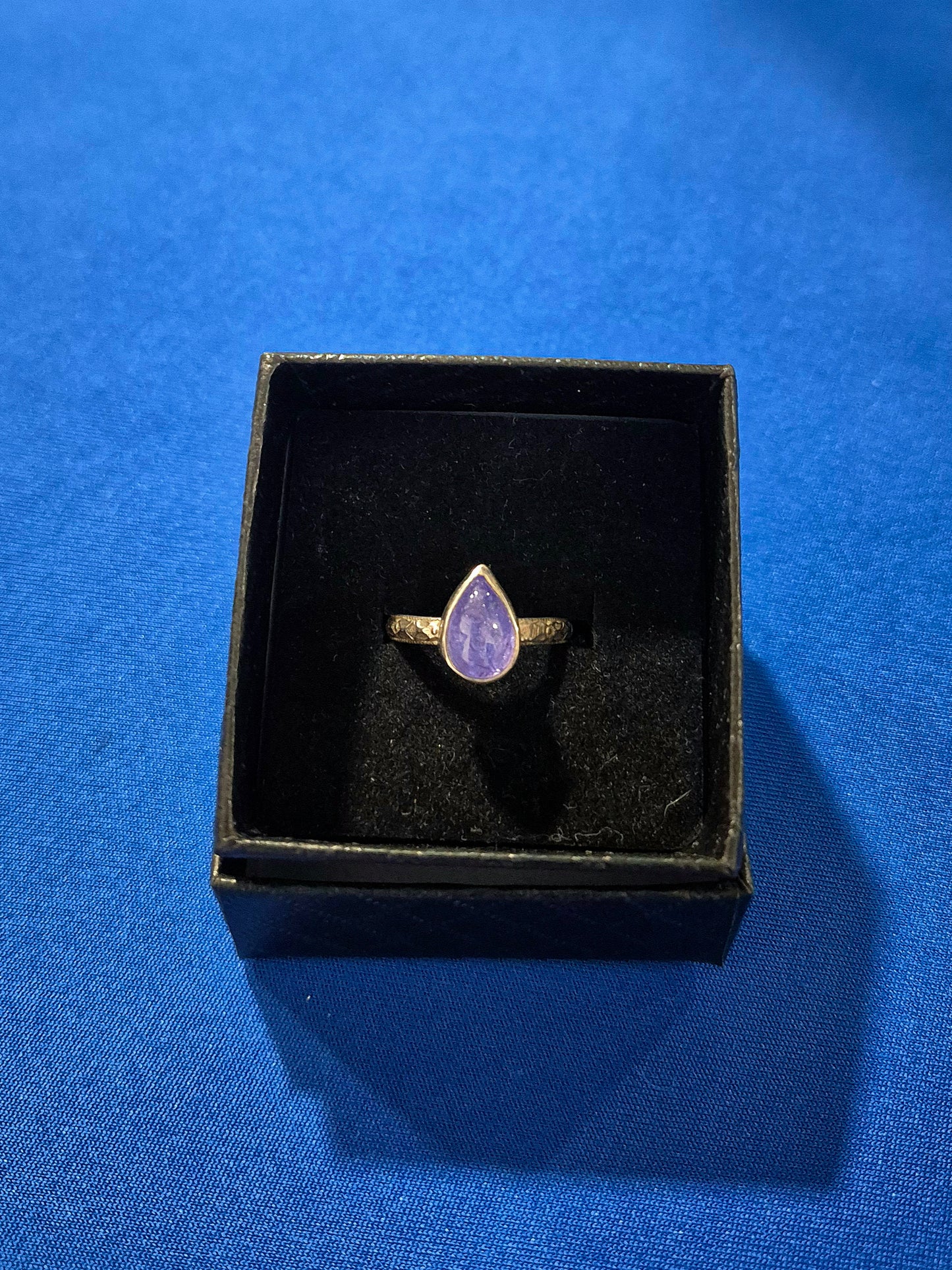 Sterling silver tanzanite ring with floral band