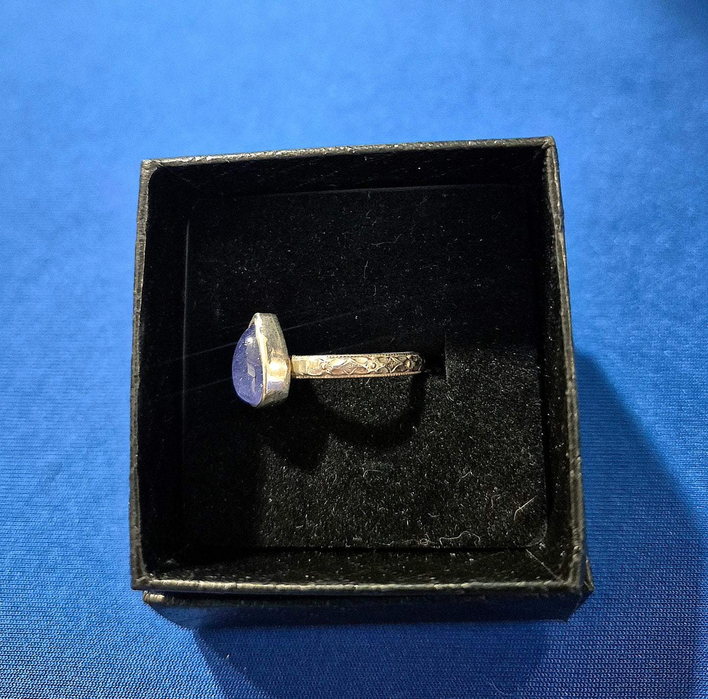 Sterling silver tanzanite ring with floral band